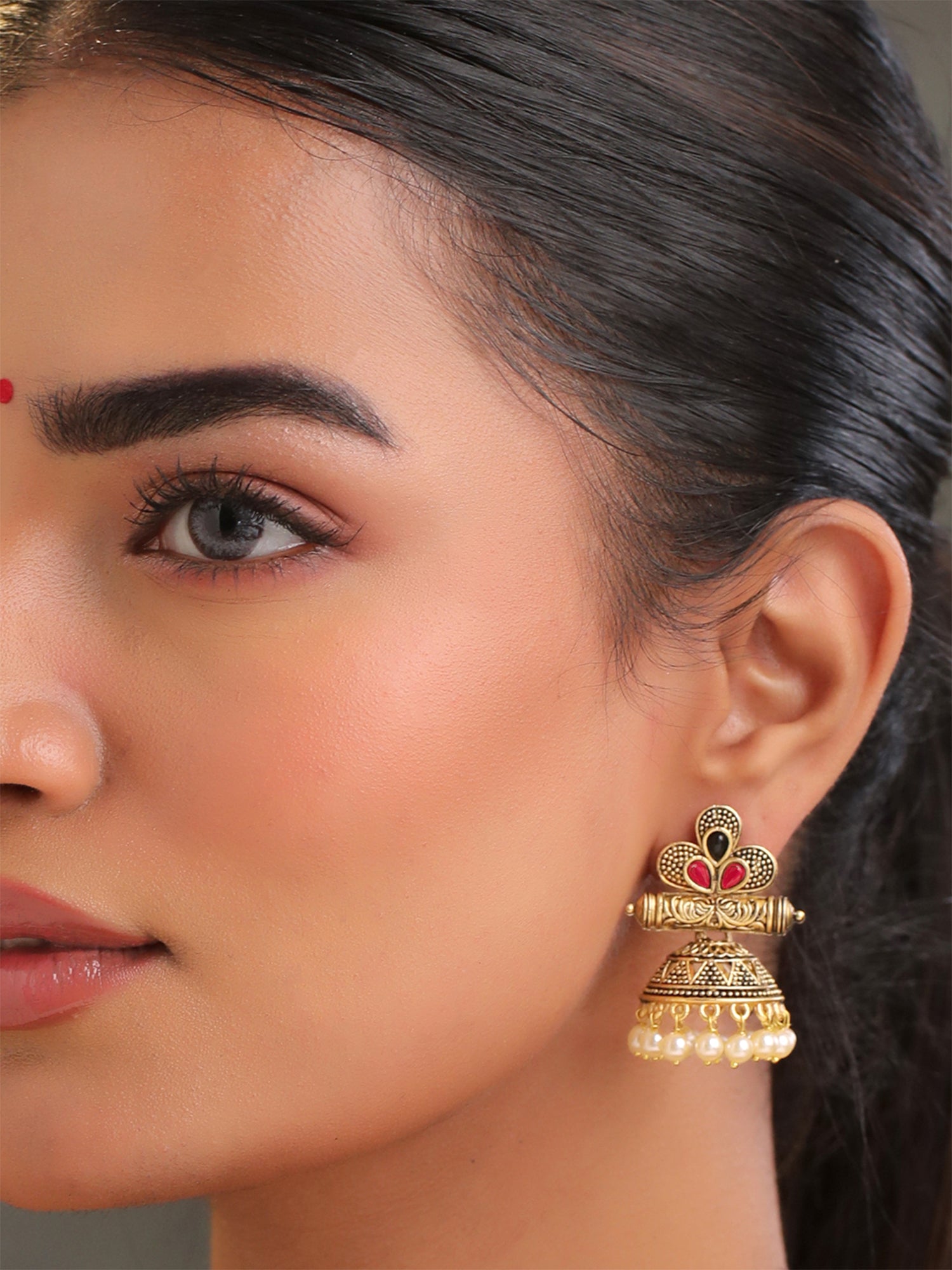Yellow Chimes gold jhumka earrings - elegant evening wear