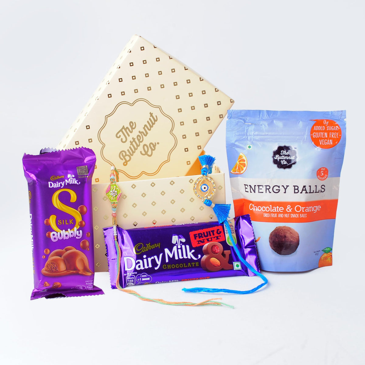 The Butternut Co Rakhi Gift Set | Rakhi For Brother And Bhabhi | Chocolate Gift Pack I Cadbury Chocolates With Rakhi I Protein Energy Balls I Fruit And Nut | Cadbury Silk Bubbly I 2 Rakhis