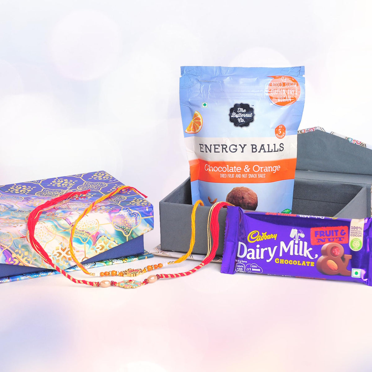 The Butternut Co. Rakhi Gift Set | Rakhi For Brother And Bhabhi | Chocolate Gift Pack I Cadbury Chocolates With Rakhi I Protein Energy Balls I Fruit And Nut | Cadbury Silk | 2 Rakhis